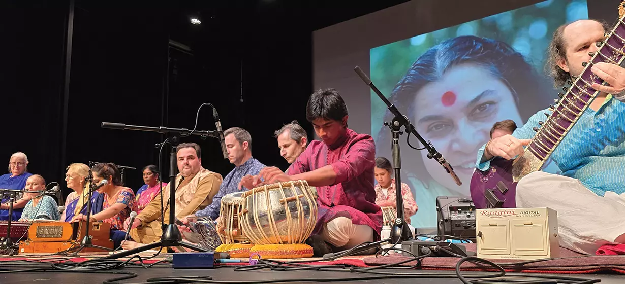 Indian  musician in a baithak setting